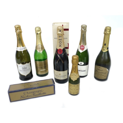 102 - A group of four and a half bottles of champagne and sparking wine, including a bottle of Moet & Chan... 