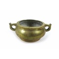 A Chinese polished bronze censer, of twin handled squat circular form, raised on a high foot rim, ca... 