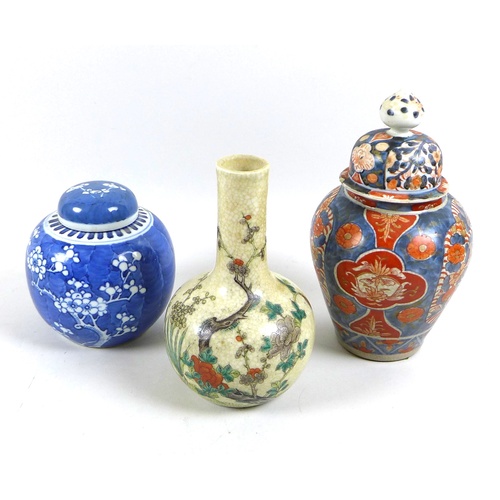 31 - A group of Chinese ceramic vases, comprising a bottle vase, famille vert decorated with prunus bloss... 