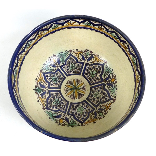 15 - A large Iznik style polychrome tin glazed earthenware pottery bowl, likely 19th century, the cream g... 