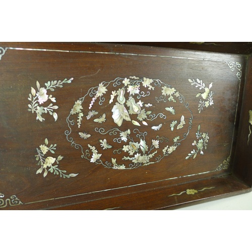 19 - A group of three Oriental hardwood trays, comprising a Chinese tray with inlaid mother of pearl deco... 