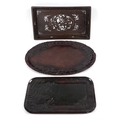 A group of three Oriental hardwood trays, comprising a Chinese tray with inlaid mother of pearl deco... 