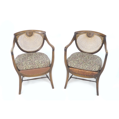 263 - A pair of Edwardian oak open armchairs, with bergere seats and backs, each 56 by 56 by 80.5cm high. ... 