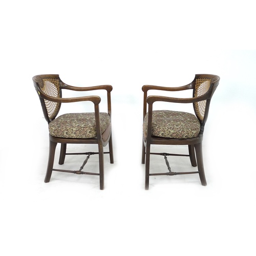 263 - A pair of Edwardian oak open armchairs, with bergere seats and backs, each 56 by 56 by 80.5cm high. ... 