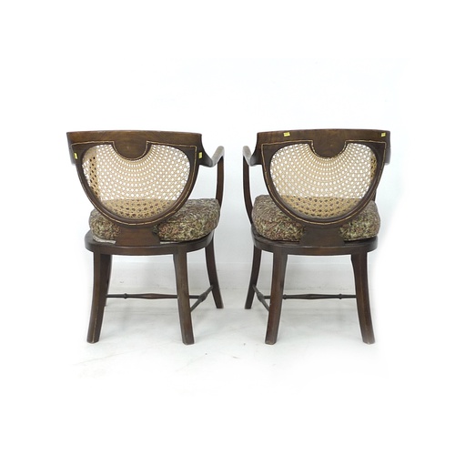 263 - A pair of Edwardian oak open armchairs, with bergere seats and backs, each 56 by 56 by 80.5cm high. ... 