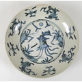 A South East Asian porcelain dish, possibly Korean, decorated in blue and white to a central roundel... 