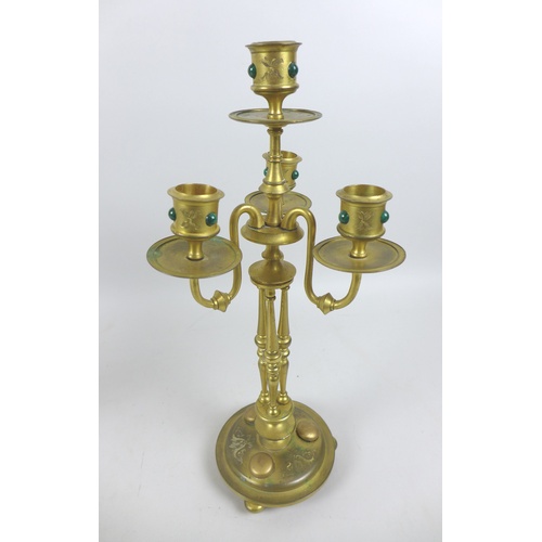 87 - A pair of mid 20th century gilt metal four branch candelabra, inlaid with malachite cabochons, each ... 