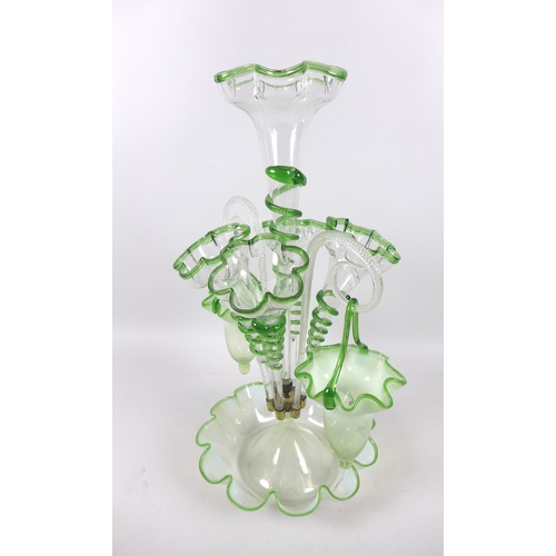 77 - A Victorian epergne, each green vaseline glass flutes with applied glass serpent decoration, raised ... 