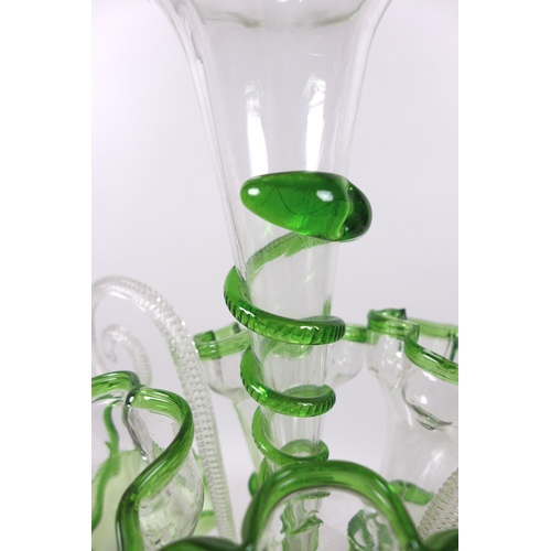 77 - A Victorian epergne, each green vaseline glass flutes with applied glass serpent decoration, raised ... 