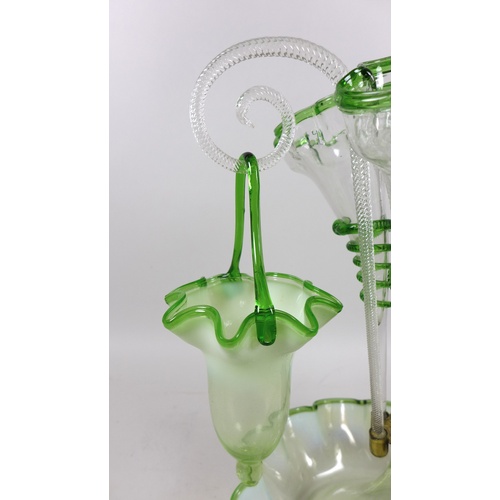 77 - A Victorian epergne, each green vaseline glass flutes with applied glass serpent decoration, raised ... 