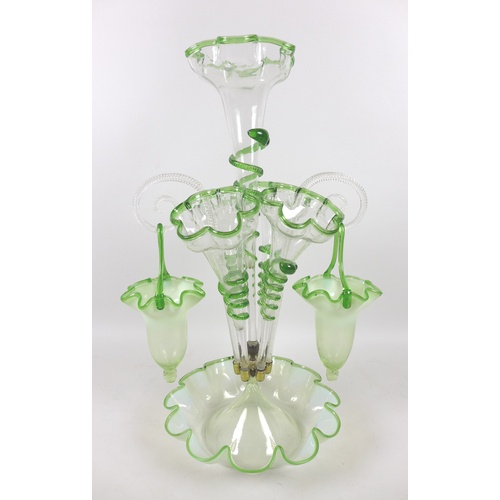 77 - A Victorian epergne, each green vaseline glass flutes with applied glass serpent decoration, raised ... 