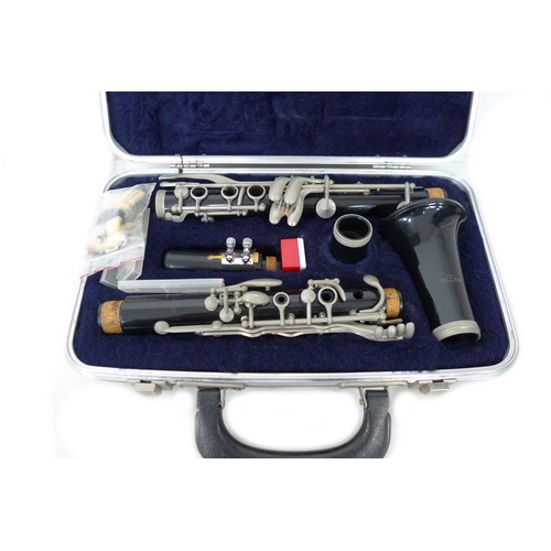 171 - A cased USA made Encore clarinet with accessories and four marching flutes, including one by Rose-Mo... 