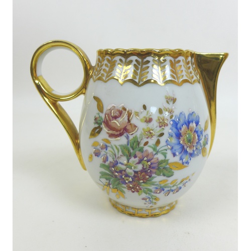 62 - A Limoges Bernardaud B & Cie part tea and coffee service, with gilt decoration and floral design, tw... 