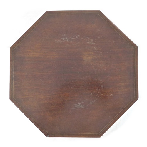 276 - An Edwardian mahogany and line inlaid sewing table, the octagonal surface lifting to reveal storage ... 