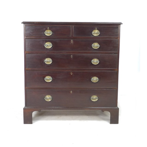 316 - A George III mahogany chest of two over four graduating drawers, with brass ring handles, raised on ... 