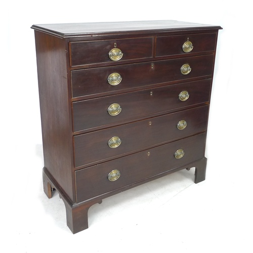 316 - A George III mahogany chest of two over four graduating drawers, with brass ring handles, raised on ... 