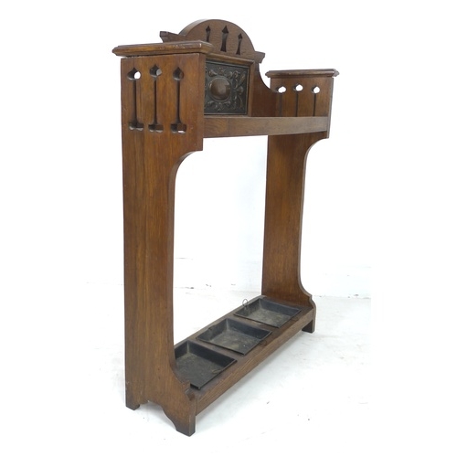 278 - An Arts and Crafts oak stick stand, with decorative inlaid copper plaque, pierced decoration, metal ... 