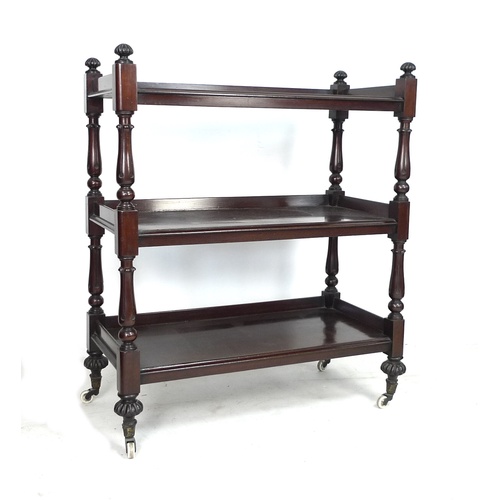 298 - A William IV / early Victorian mahogany three tier buffet server, with turned supports, raised upon ... 