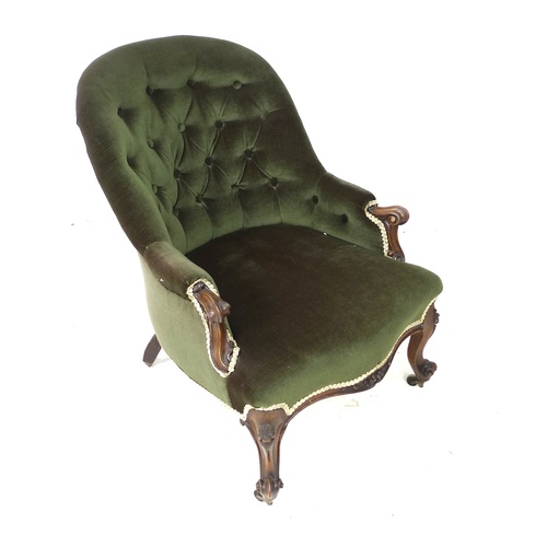 285 - A Victorian spoon back armchair, with green button back upholstery, raised upon mahogany cabriole sc... 