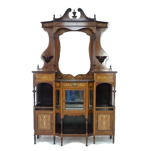 317 - An Edwardian mahogany breakfront chiffonier, with a broken pediment top above a large shield form mi... 