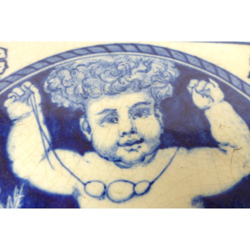 63 - A 19th century Mintons blue and white tile, featuring a cherub holding up a necklace, bearing marks ... 