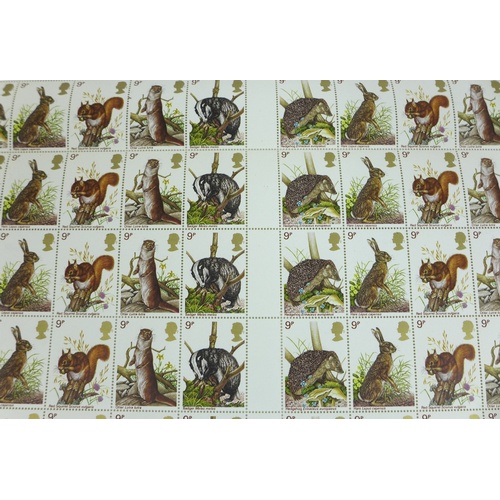 142 - Three sheets of QEII mint stamps, comprising a sheet of one hundred QEII 1977 British Wildlife 9p st... 