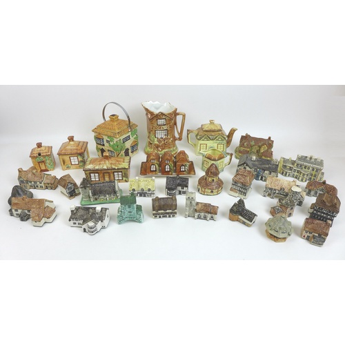 45 - A large collection of ceramic buildings, prominently from the 'Britain in Miniature' series from the... 
