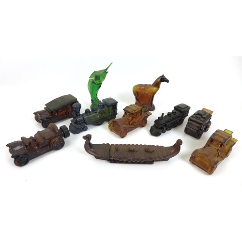 48 - A collection of vintage 1970s novelty aftershave bottles, shaped as cars, trains, a viking boat, a h... 