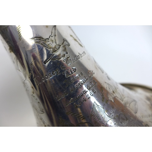 169 - A Boosey & Hawkes Ltd trumpet, with floral engraving, together with three additional mouth pieces an... 