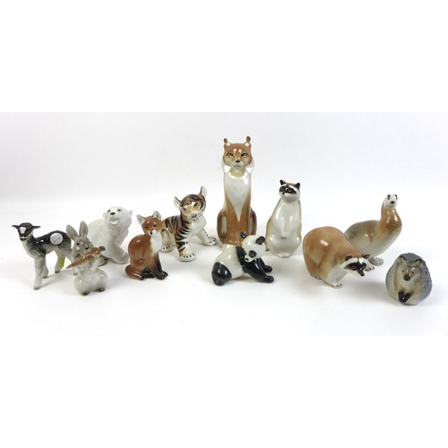 60 - A group of Russian animal figurines, including two USSR racoons, tallest 14cm, a Lomonosov Russisan ... 