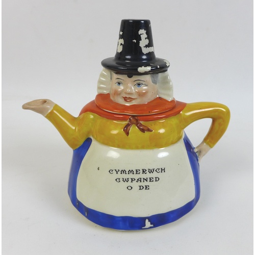 69 - A W. H. Goss Welsh Lady teapot, 14.5cm high, a/f, together with a Goss Cambridgeshire and March cres... 