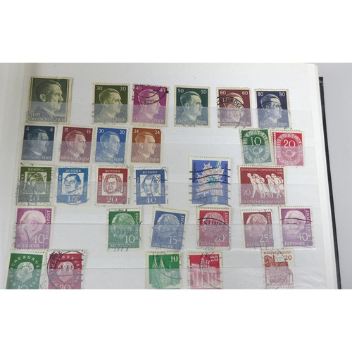 143 - An album of international stamps, including some of Eastern German and Chinese stamps, together with... 