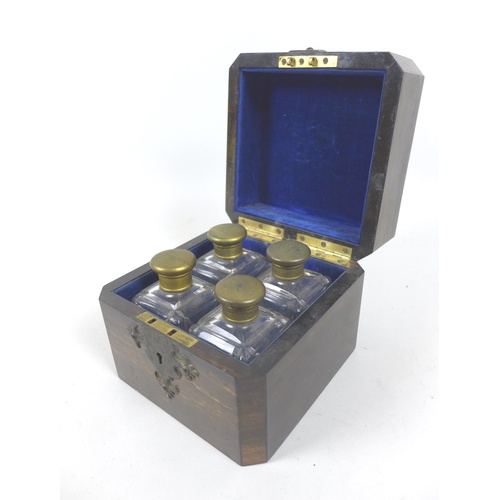 90 - An early / mid 19th century coromandel perfume bottle case, of square form, its lid inset with a cen... 