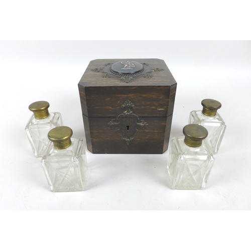 90 - An early / mid 19th century coromandel perfume bottle case, of square form, its lid inset with a cen... 