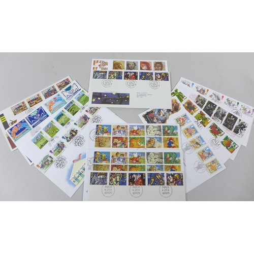 144 - A collection of Royal Mint Stamps, commemorative coins and postcards, including a limited edition, o... 