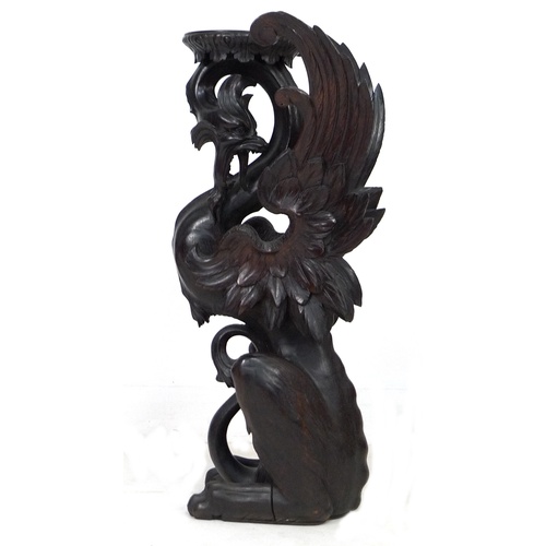 323 - A Continental 19th century finely carved oak Pixiu style form jardiniere stand, with its shaped top ... 