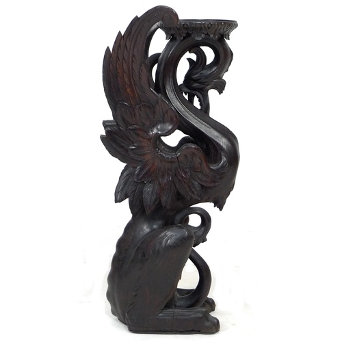 323 - A Continental 19th century finely carved oak Pixiu style form jardiniere stand, with its shaped top ... 