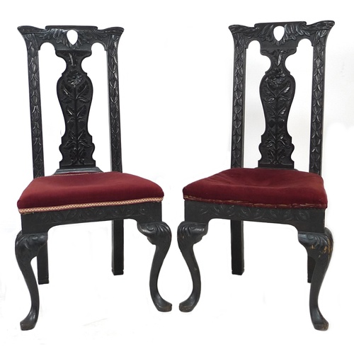 302 - A pair of late 19th century stained oak dining chairs, with poker work carved frames and splat backs... 