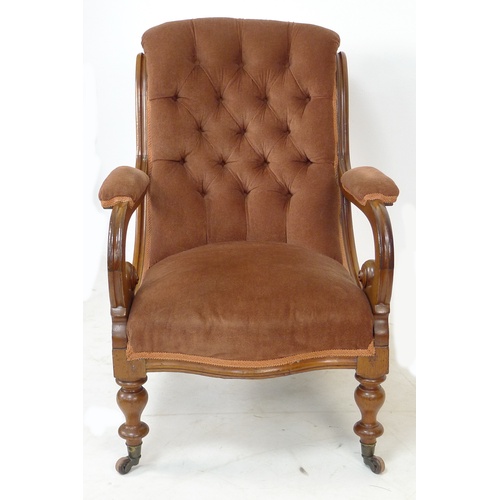 296 - A Victorian button backed mahogany framed open armchair, with brown velvet upholstered seat, back an... 