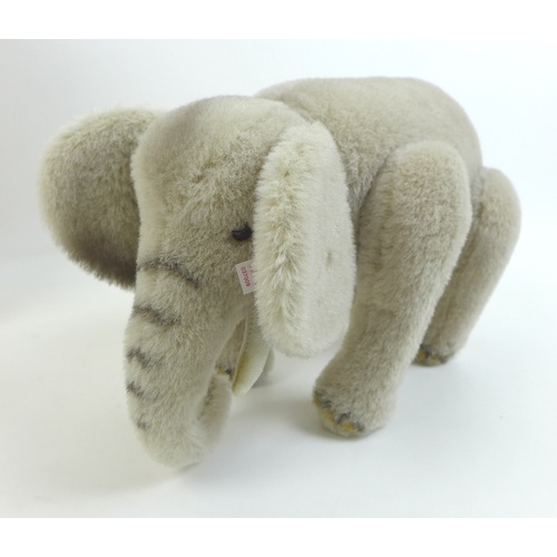 148 - A limited edition Steiff elephant, in grey, edition 834/2006, 33cm long, with original box and certi... 