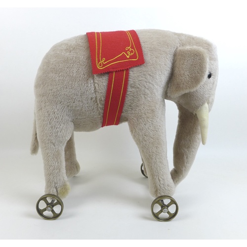 159 - A limited edition Steiff Elephant on wheels, replica of 1903/04 model in grey, edition 34/1000, moha... 