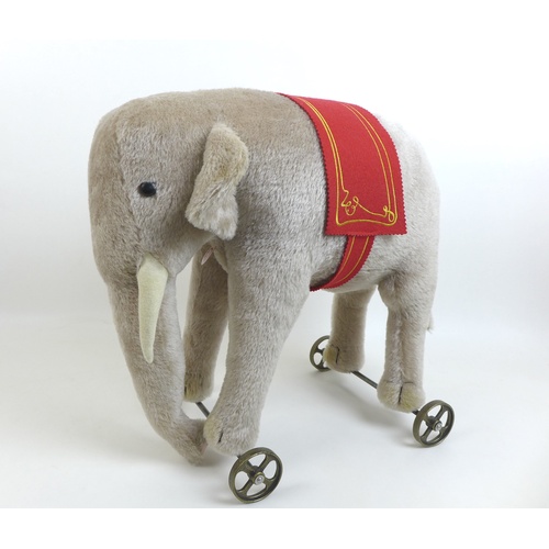 159 - A limited edition Steiff Elephant on wheels, replica of 1903/04 model in grey, edition 34/1000, moha... 