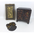 A group of Japanese wooden items, comprising an early 20th century Japanned jewellery box in the sty... 
