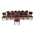 A set of fourteen late Victorian mahogany dining chairs, with shaped and moulded backs, upholstered ... 