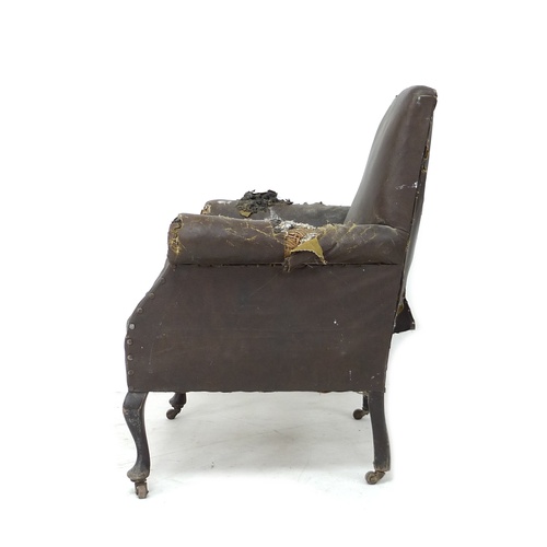 284 - An Edwardian armchair with scroll over arms, cabriole front legs and castors, 74 by 73 by 81cm high.