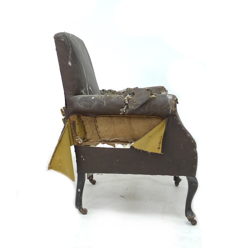 284 - An Edwardian armchair with scroll over arms, cabriole front legs and castors, 74 by 73 by 81cm high.