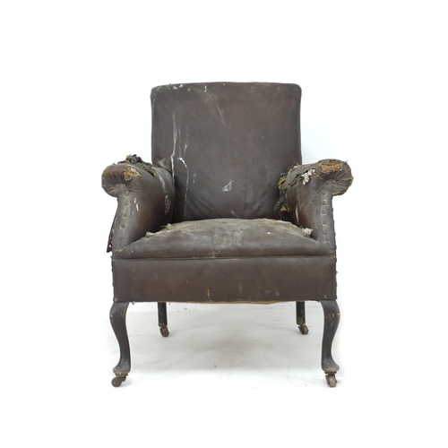 284 - An Edwardian armchair with scroll over arms, cabriole front legs and castors, 74 by 73 by 81cm high.