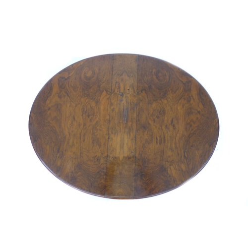 304 - A Victorian walnut drop leaf table, the circular surface with moulded edge, raised on central and fo... 