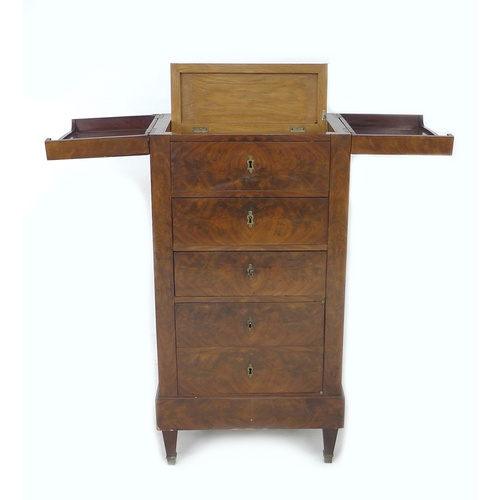 305 - A French late 19th century mahogany veneered over oak drinks cabinet, the surface opening out in two... 