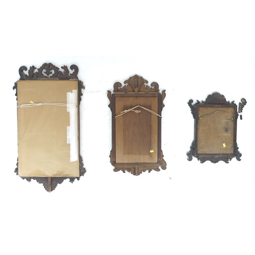 268 - A group of three Georgian silhouette framed mirrors, the largest with walnut frame and gilt mount, t... 